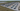 Aerial view of a large crypto mining farm in South Carolina with numerous containers housing mining equipment and power infrastructure.